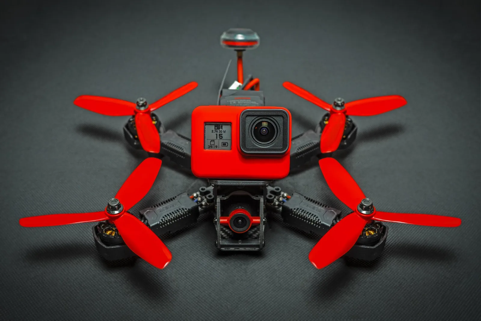 Camera-equipped drone with red propellers